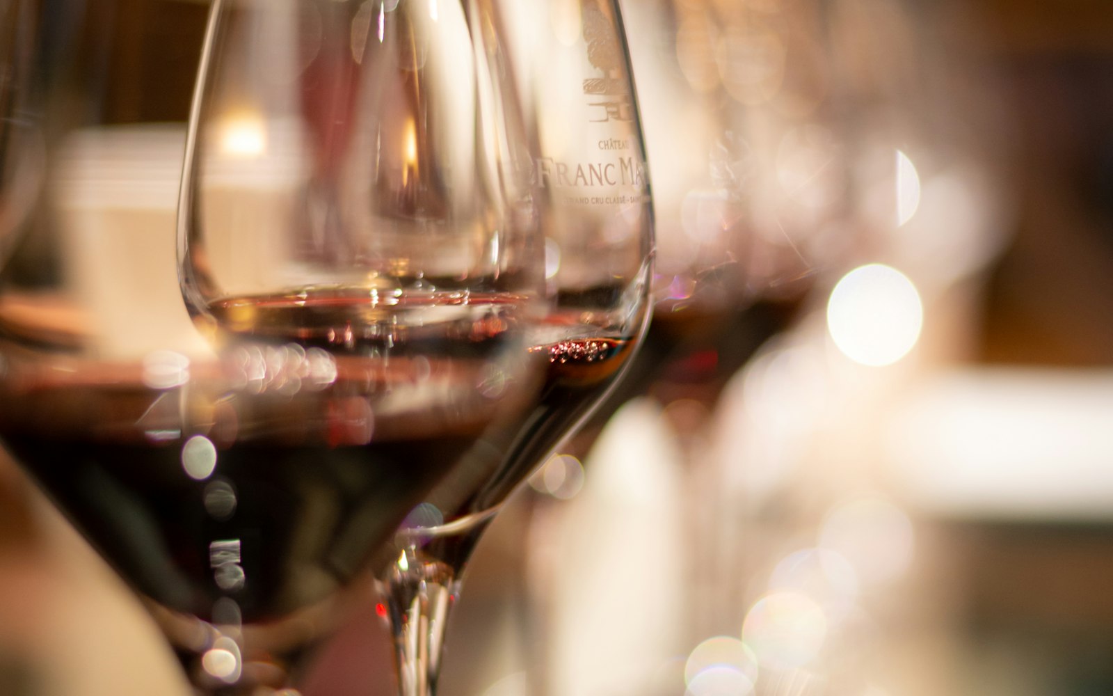 Deep red wine glowing in a stem glass — cellared at the right temperature